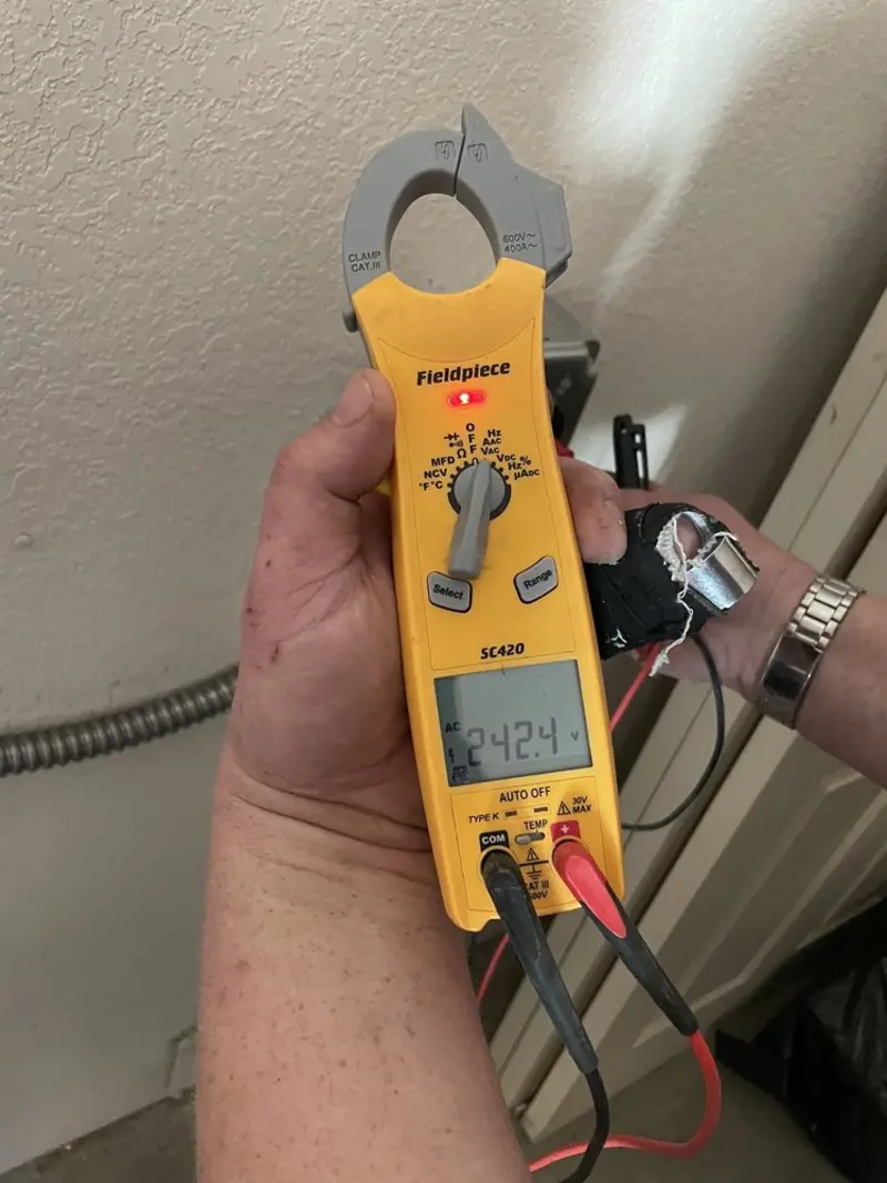 Voltage testing with clamp meter during Recessed Lighting Installation in Pingree Grove